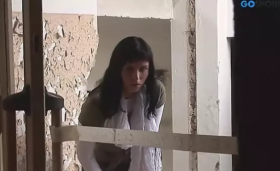 Brunette takes on two hard cocks simultaneously